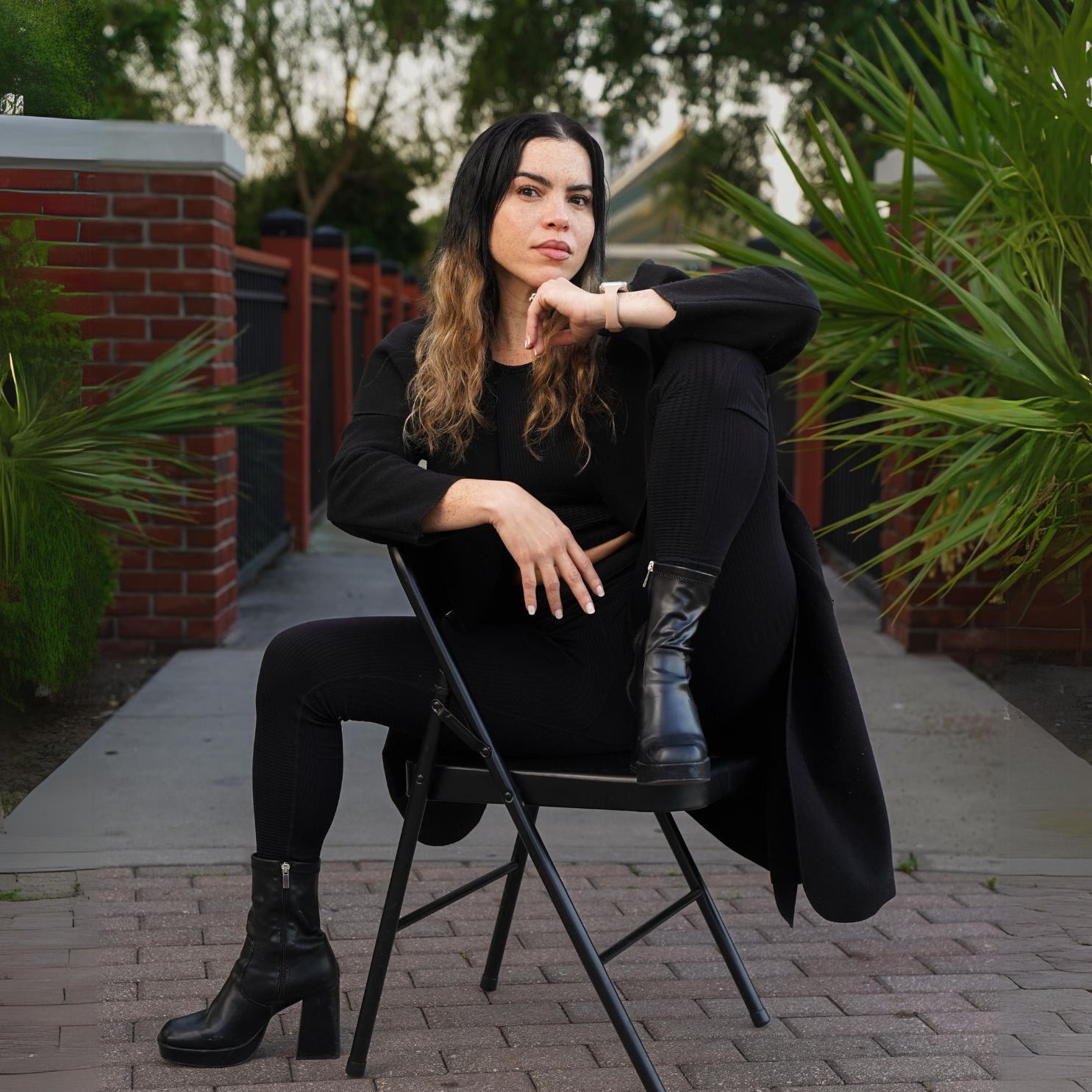 picture of a woman sitting down on a chair posing. 
Tampa Top Headshot Photographer